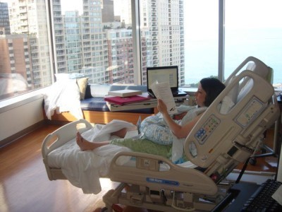 Holly Rust working, just hours after delivering her son. Pic coutesy of Huffington Post